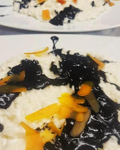 Risotto al prosecco, nero di seppia e Bottarga